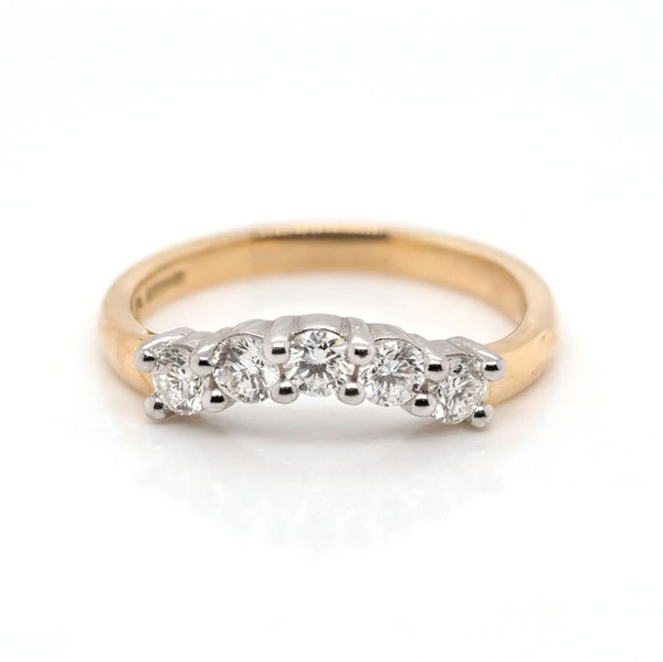 A yellow and white gold five stone brilliant cut diamond ring