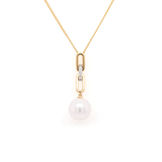 A yellow gold white pearl and diamond link drop pendant on a gold chain