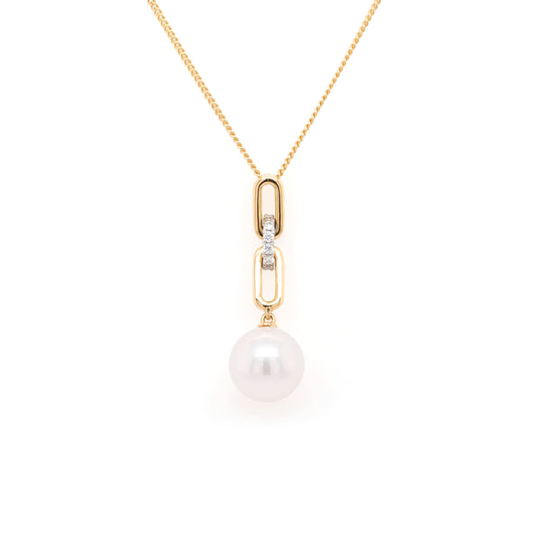 A yellow gold white pearl and diamond link drop pendant on a gold chain