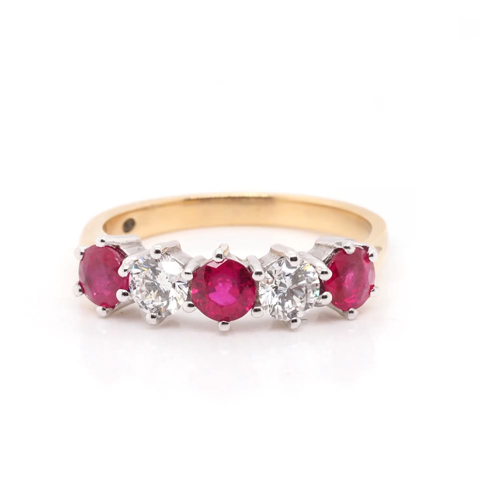 A five stone ruby and diamond ring in yellow and white gold
