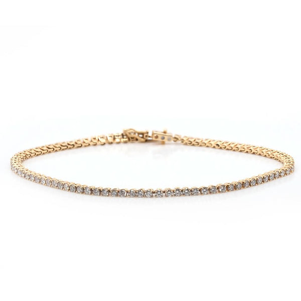 A yellow gold line bracelet set with brilliant cut diamonds