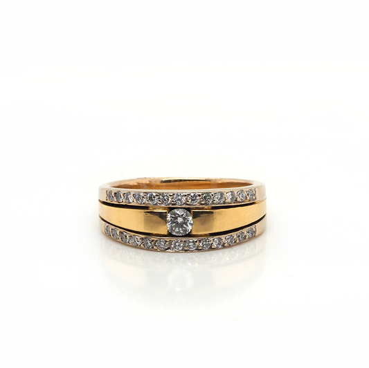 A yellow gold three row diamond band ring