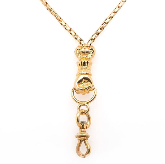 A yellow gold chain necklace with a clasped hand pendant and clasp drop
