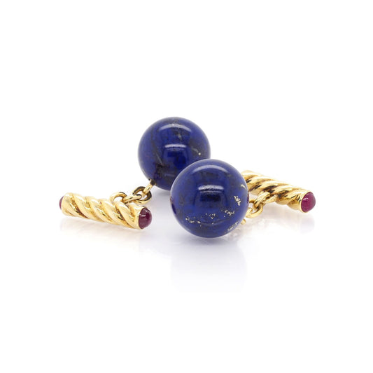 A pair of lapis ball cufflinks in yellow gold with ruby end fittings