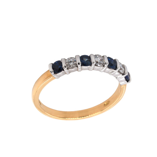 A round sapphire and diamond bar set half eternity ring in yellow and white gold