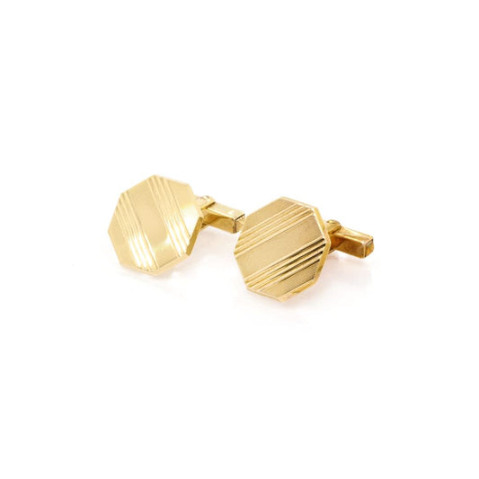 A pair of yellow gold octagonal cufflinks with striped patterns