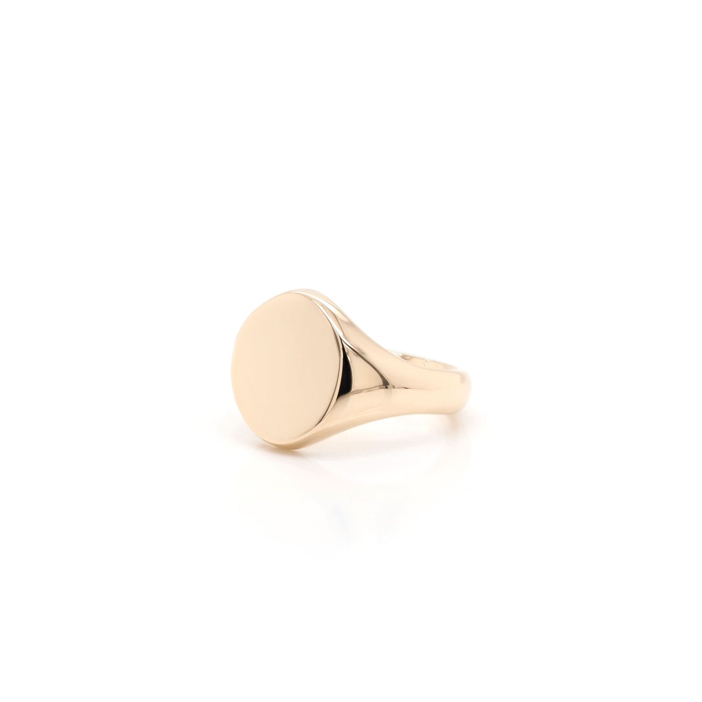 A yellow gold, plain, oval, polished signet ring