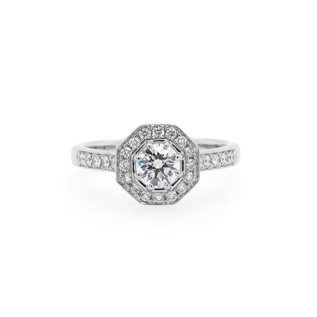 Jewellery A Platinum Brilliant-Cut Octagonal Diamond Cluster Ring with Diamond-Set Shoulders