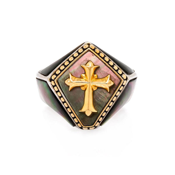 A shield-shaped signet ring with a gold cross and black mother of pearl