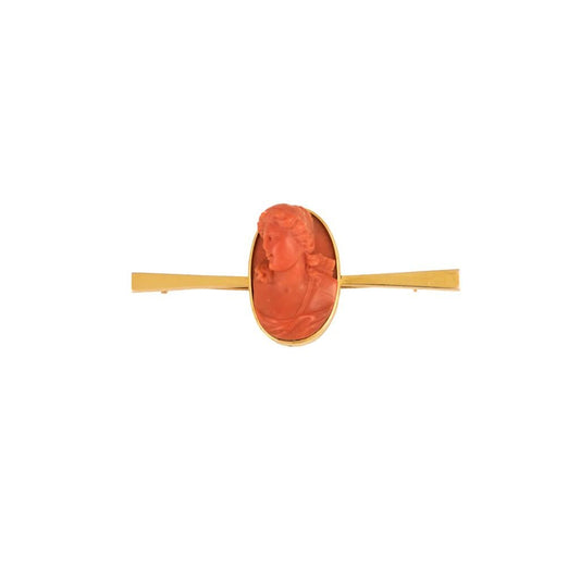 An 18ct yellow gold, coral, Camio bar brooch