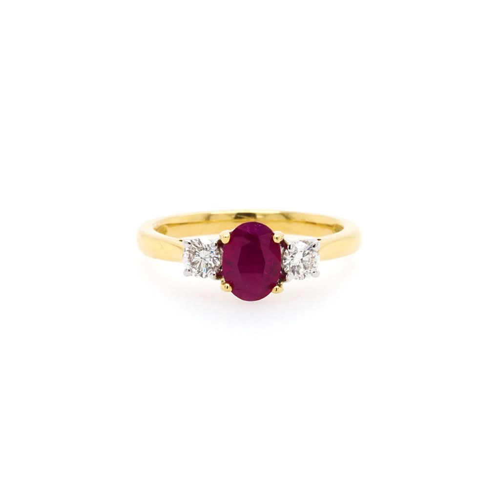 Jewellery An 18ct Yellow Gold Three-Stone Oval Ruby and Diamond Engagement Ring