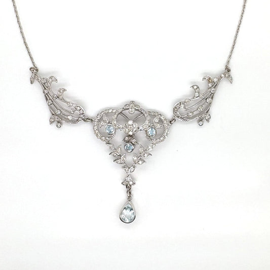 A white gold aquamarine and diamond ornate pendant necklace