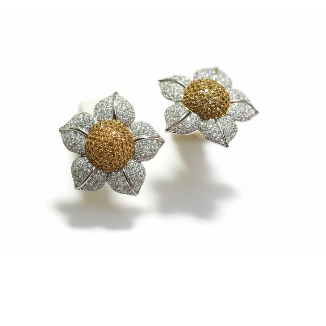 A pair of white gold flower earrings set with yellow sapphires and white diamonds