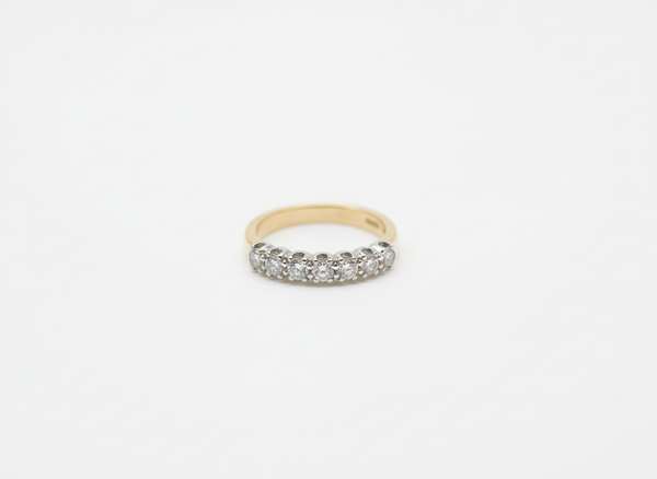A yellow and white gold brilliant cut diamond half eternity ring