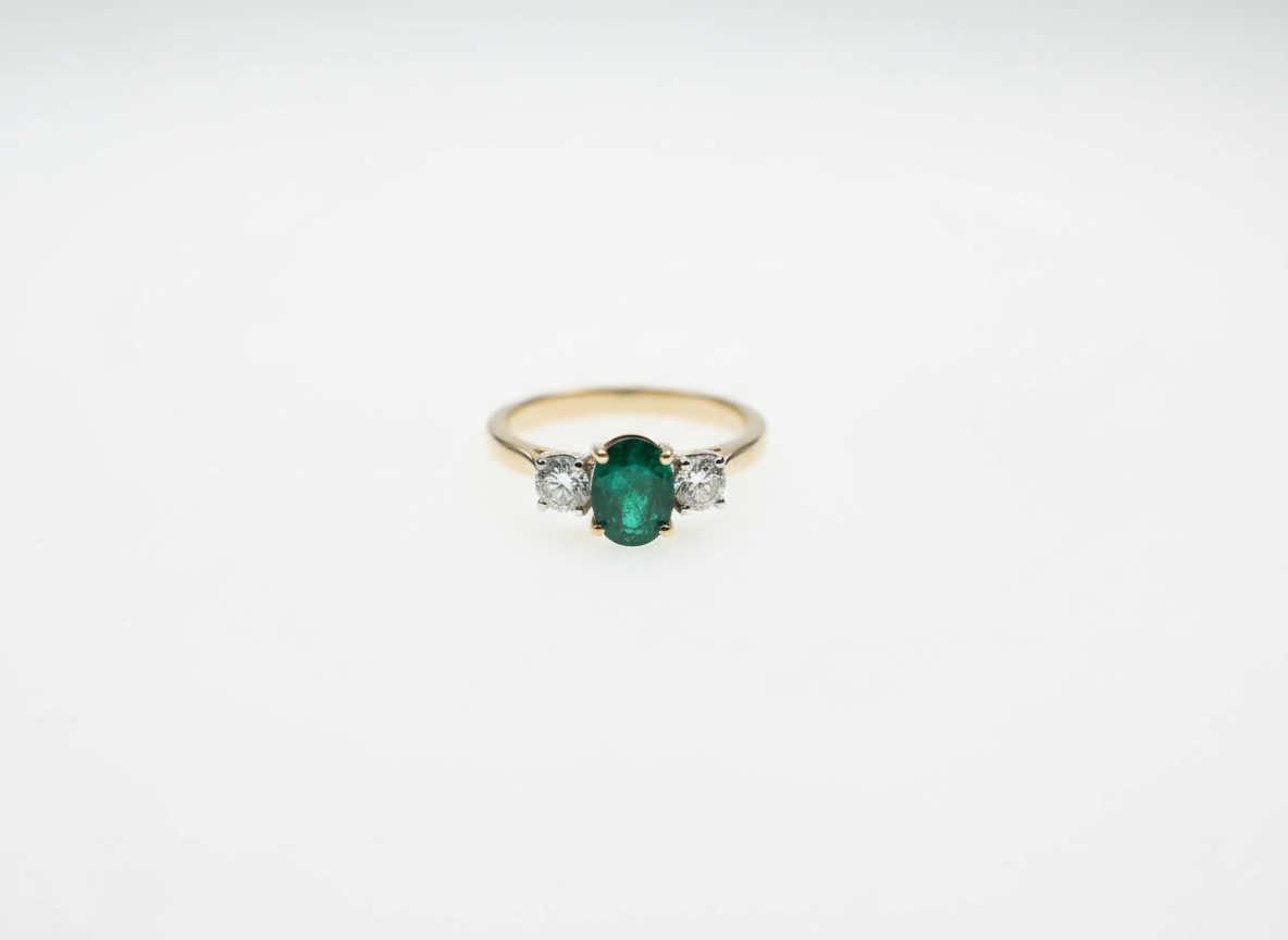 Emerald and Diamond Three-Stone Engagement Ring in 18ct Yellow Gold