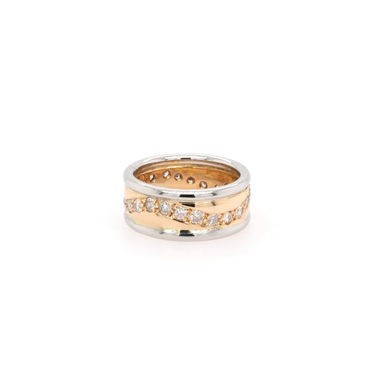 A yellow gold and platinum band with a wave of diamonds