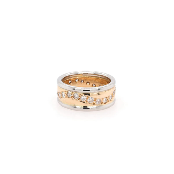 A yellow gold and platinum band with a wave of diamonds