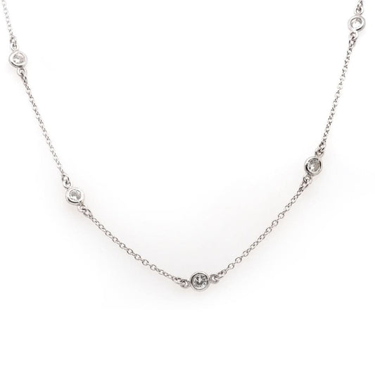 A platinum station chain necklace with brilliant cut diamonds