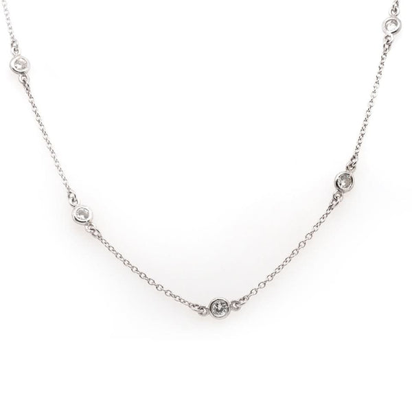 A platinum station chain necklace with brilliant cut diamonds