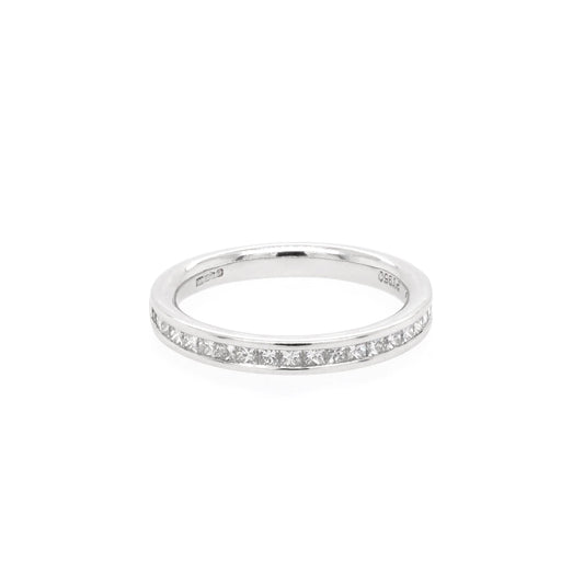 A platinum half eternity band channel set with princess cut diamonds