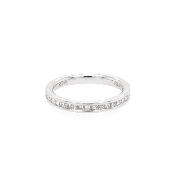 A platinum half eternity band channel set with princess cut diamonds