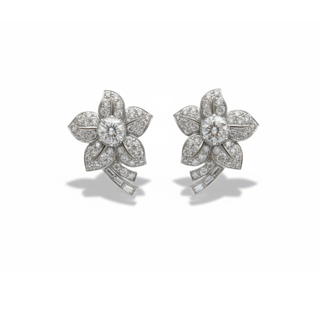 A pair of flower shaped earrings with diamonds set in platinum