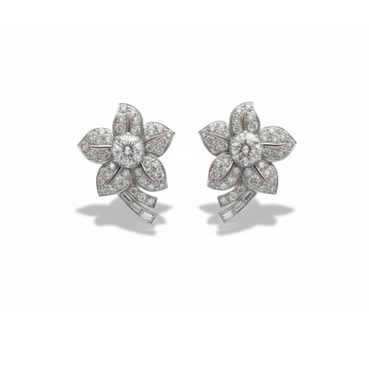 A pair of flower shaped earrings with diamonds set in platinum