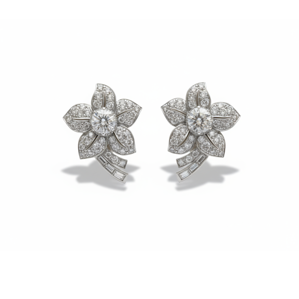 A pair of flower shaped earrings with diamonds set in platinum