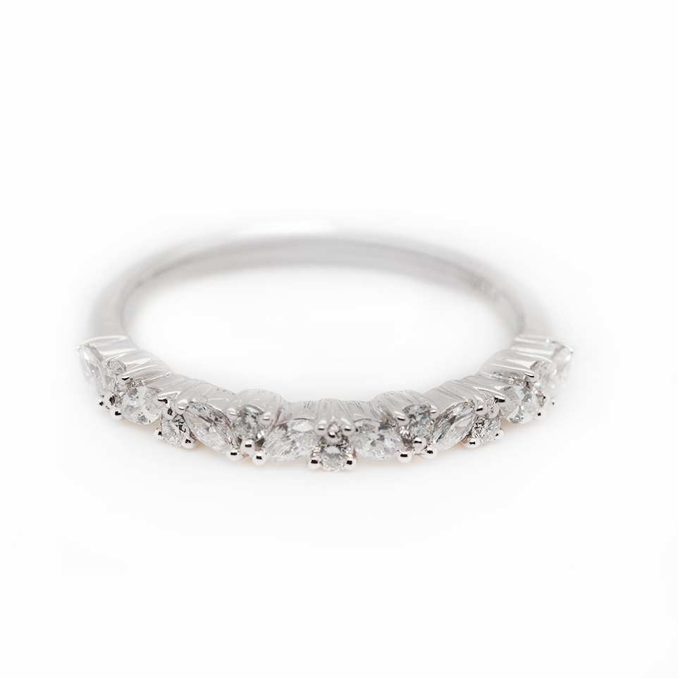 A marquise cut diamond and brilliant cut diamond half eternity ring in platinum
