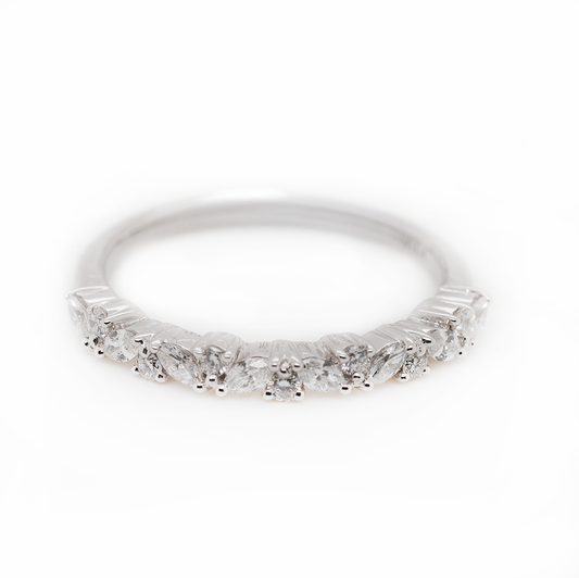 A marquise cut diamond and brilliant cut diamond half eternity ring in platinum