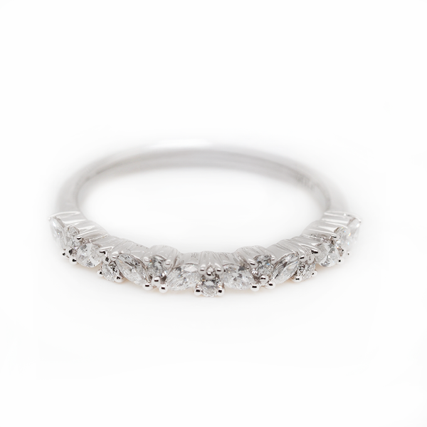 A marquise cut diamond and brilliant cut diamond half eternity ring in platinum