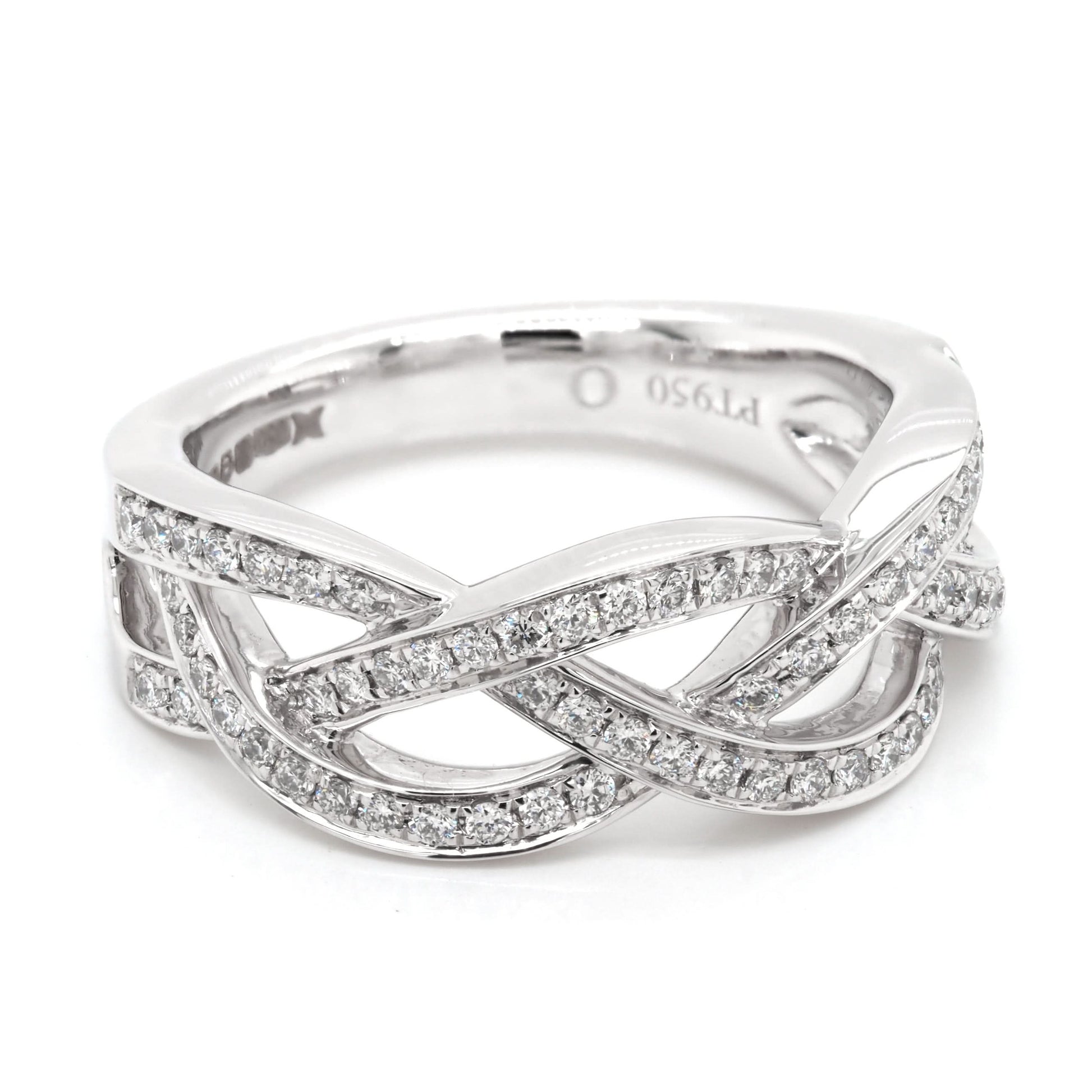A platinum set open woven design ring set with diamonds