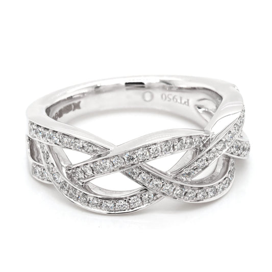 A platinum set open woven design ring set with diamonds