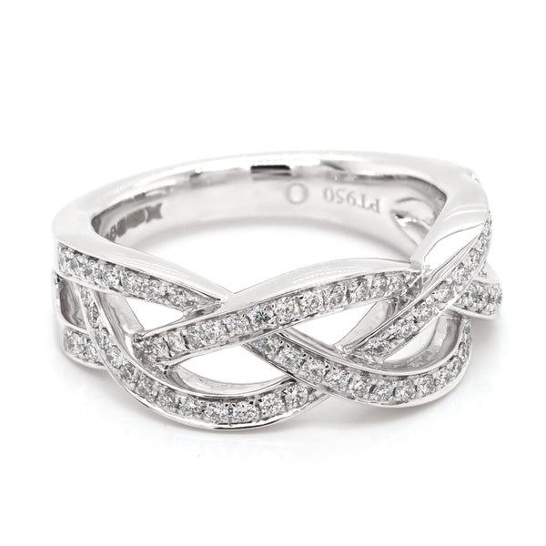A platinum set open woven design ring set with diamonds