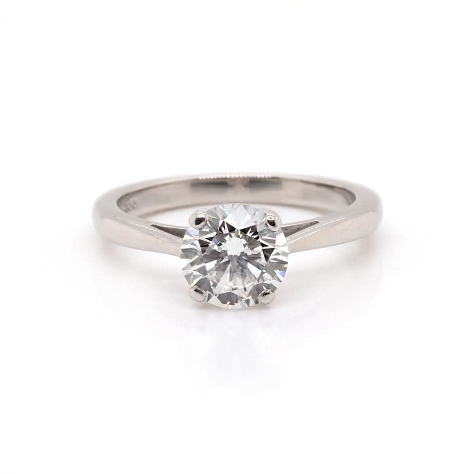 A solitaire round brilliant cut diamond ring in platinum