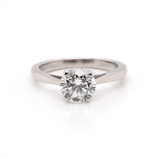 A solitaire round brilliant cut diamond ring in platinum