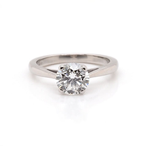 A solitaire round brilliant cut diamond ring in platinum