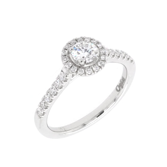 A brilliant cut diamond halo cluster ring in platinum with diamond set shoulders