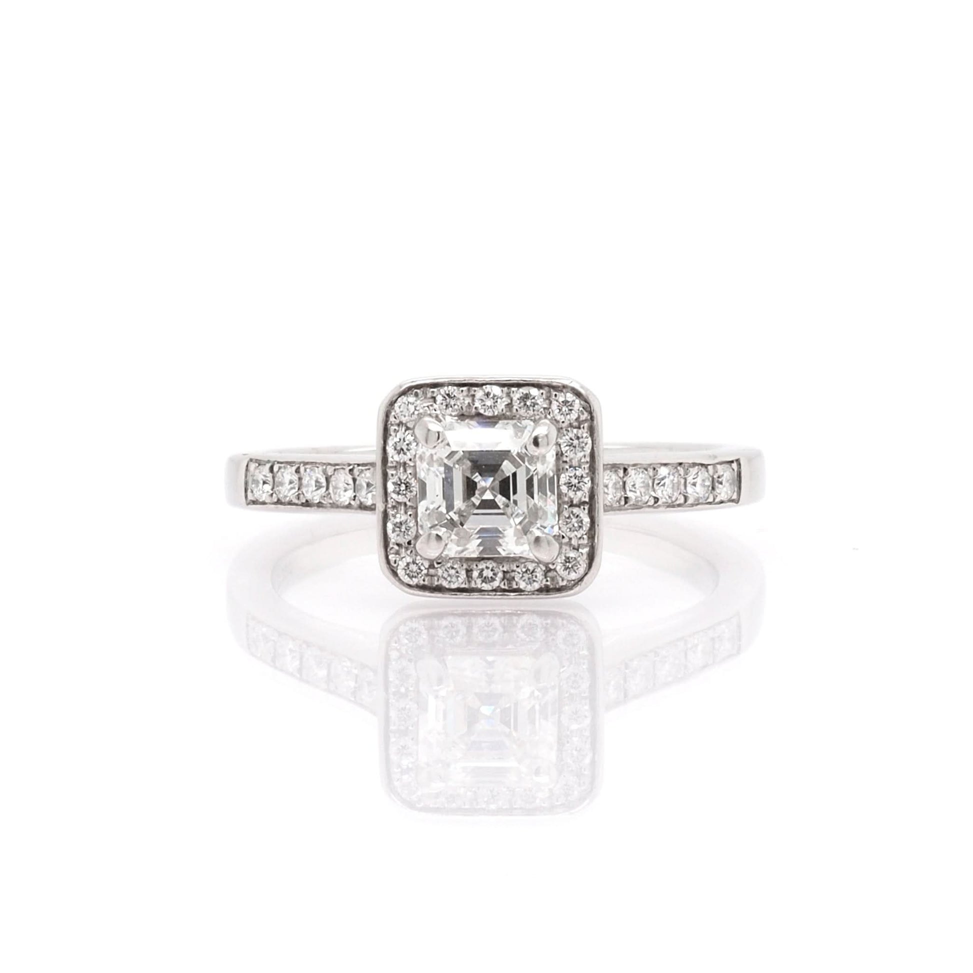 A platinum Square Diamond Cluster Ring with Diamond Set Shoulders