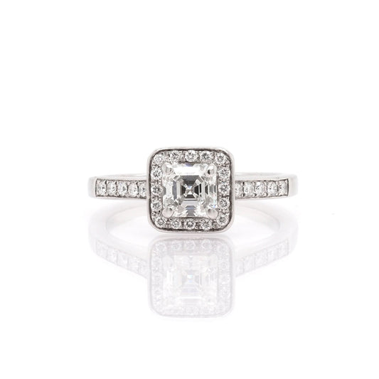 A platinum Square Diamond Cluster Ring with Diamond Set Shoulders