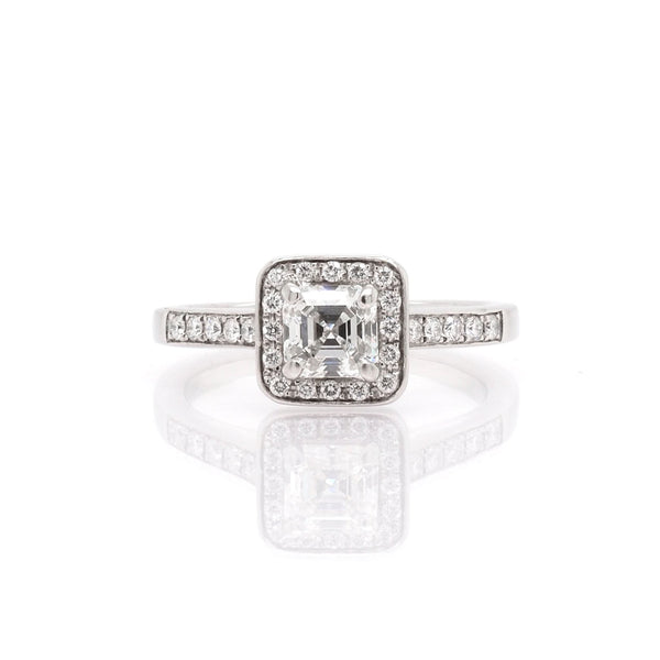 A platinum Square Diamond Cluster Ring with Diamond Set Shoulders