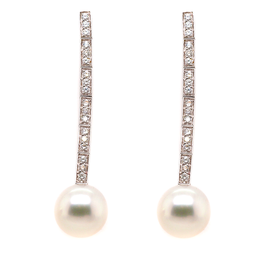 A pair of white gold diamond and pearl drop earrings