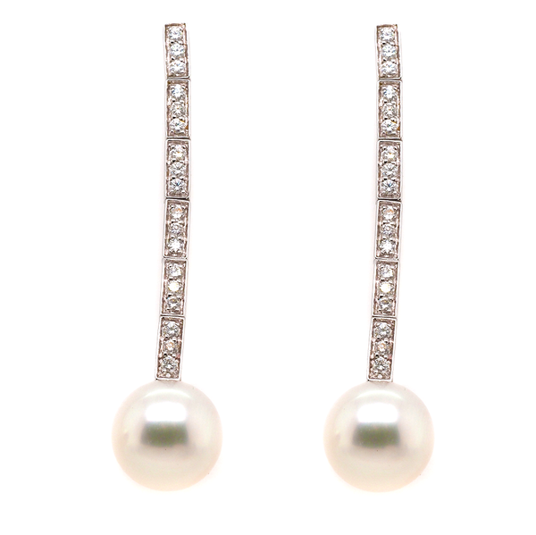 A pair of white gold diamond and pearl drop earrings