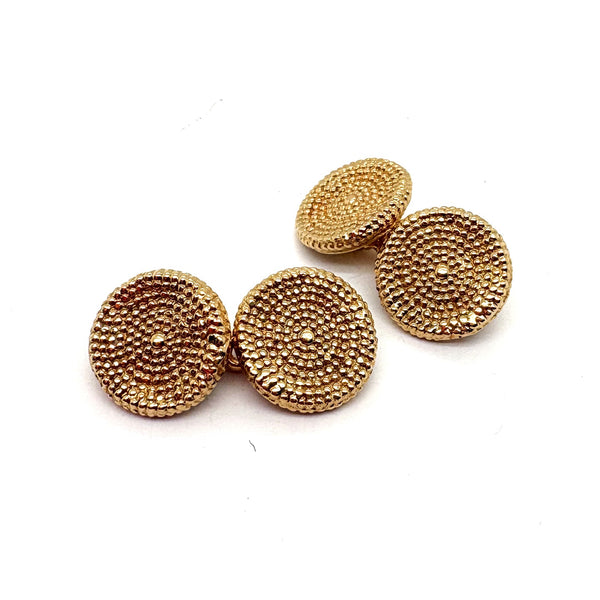 A pair of textured circular cufflinks in yellow gold