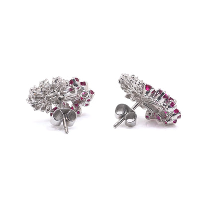 A pair of diamond and ruby fancy cluster stud earrings in platinum