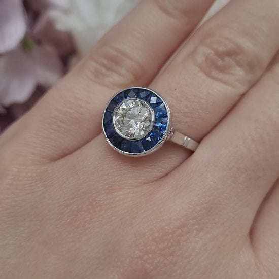 1.21ct Diamond and Calibre Sapphire Target Engagement Ring