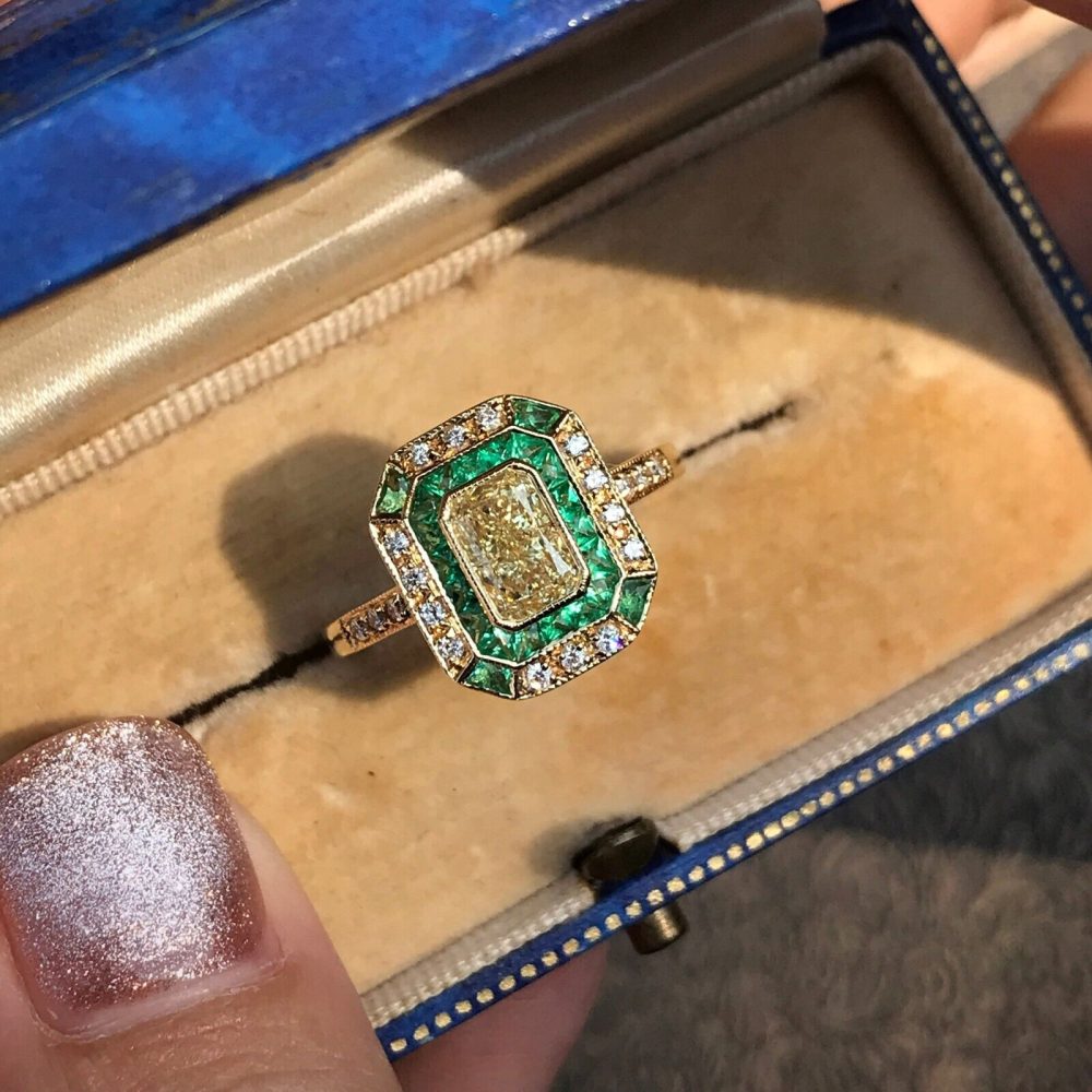 Emerald Cut Fancy Light Yellow Diamond and Emerald Cluster Engagement Ring