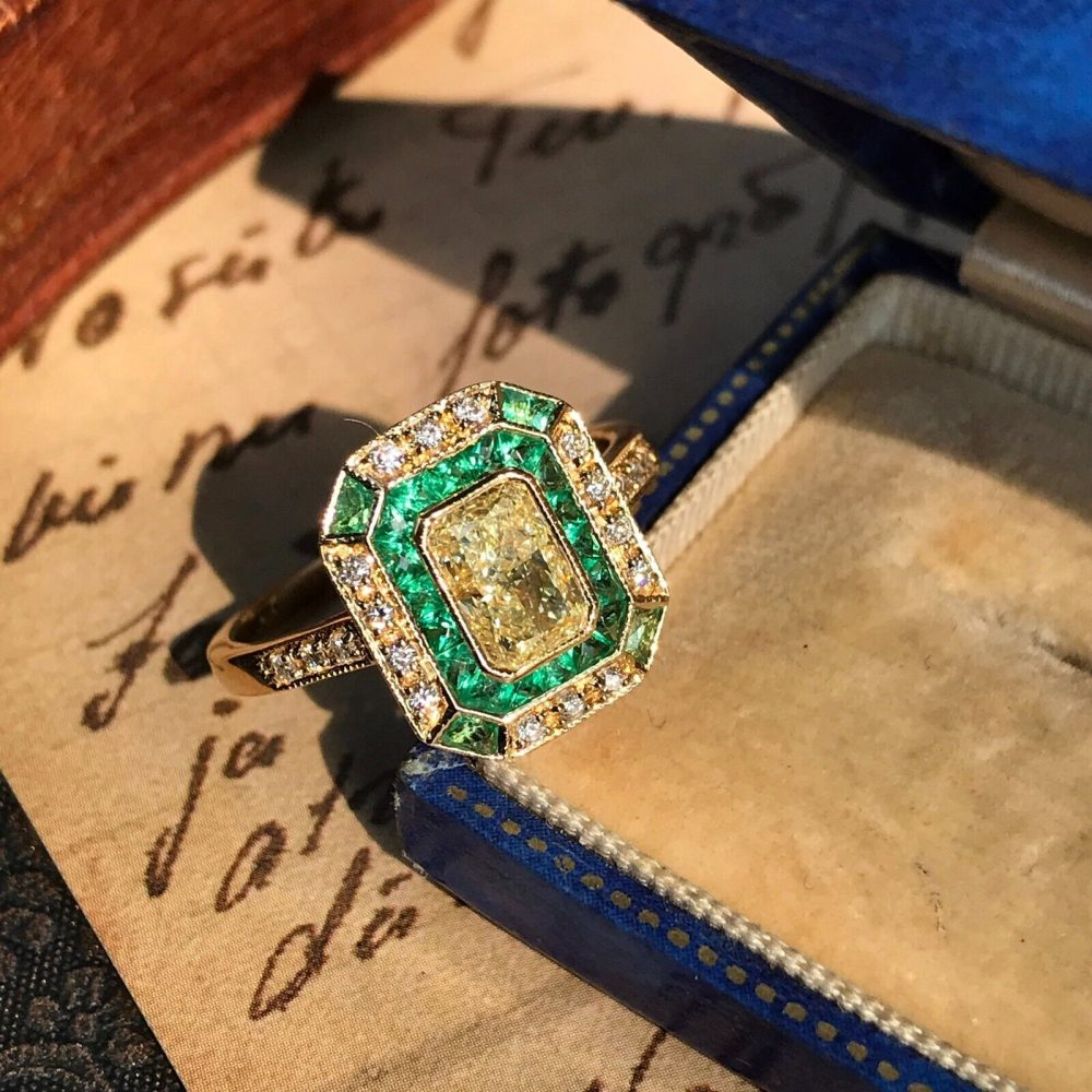 Emerald Cut Fancy Light Yellow Diamond and Emerald Cluster Engagement Ring