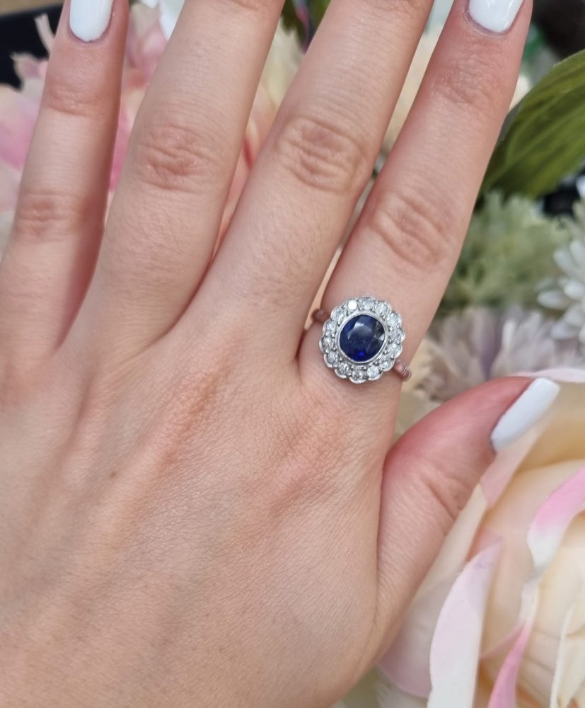Vintage sapphire and diamond cluster engagement ring in 18ct white gold