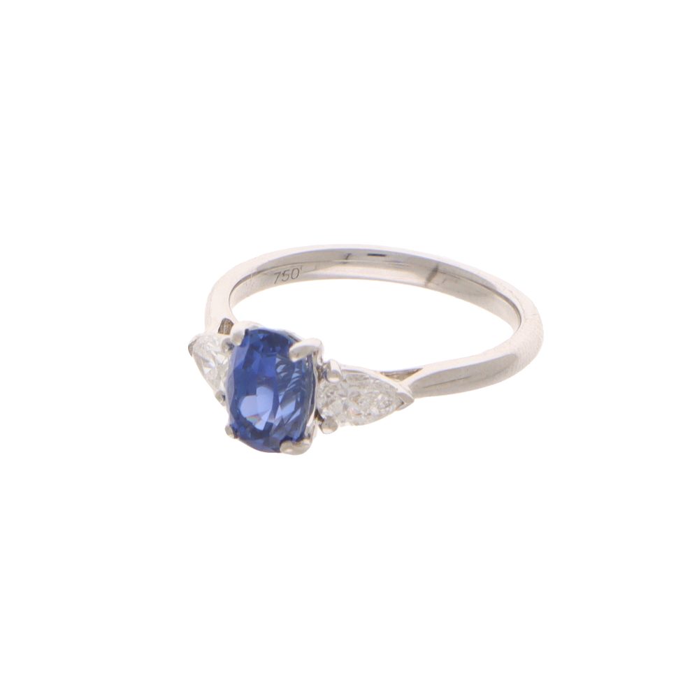 Sapphire and diamond three stone ring in white gold.